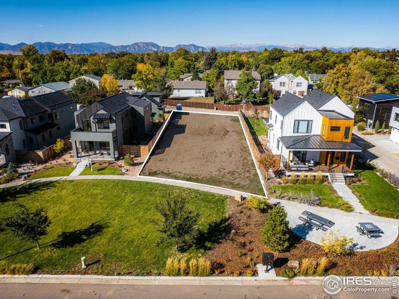 Surrounding Crescent Park, this is one of nine single-family home lots that create a welcoming enclave adorned with captivating rock sculptures, inviting picnic spots, intriguing art installations, and ample space for recreation.