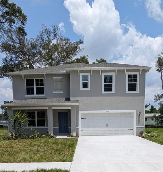 Front exterior of a new home in Buena Lago, St. Cloud, FL, highlighting curb appeal (Image 1). Front exterior of a new home in Buena Lago, St. Cloud, FL, highlighting curb appeal (Image 1).