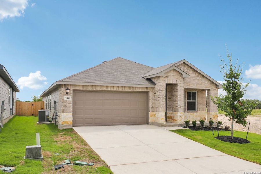 Front exterior of a new home in Thomas Pond, San Antonio, TX, highlighting curb appeal (Image 20). Front exterior of a new home in Thomas Pond, San Antonio, TX, highlighting curb appeal (Image 20).