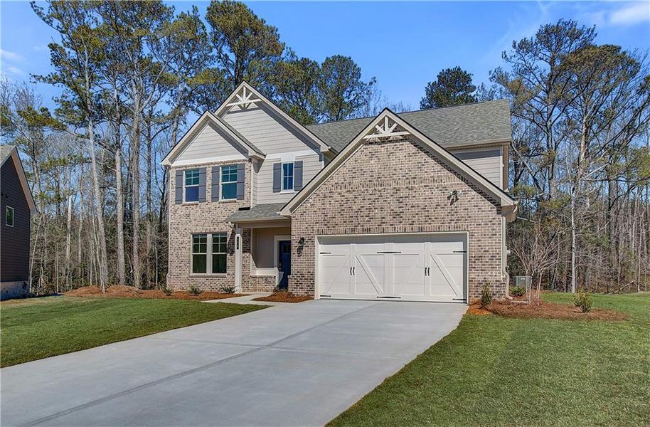 Front exterior of a new home in Copperfield, Locust Grove, GA, highlighting curb appeal (Image 2).
