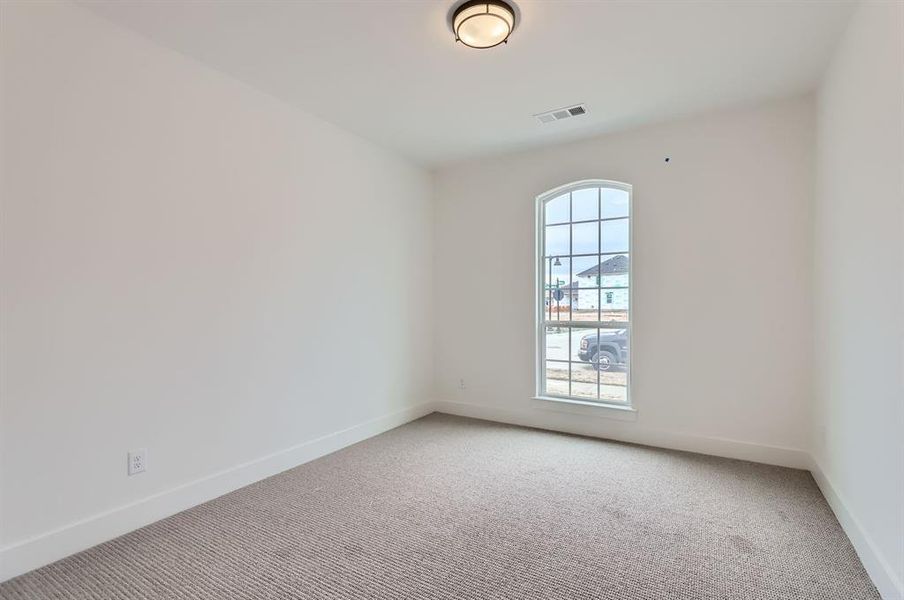 Empty room featuring carpet flooring