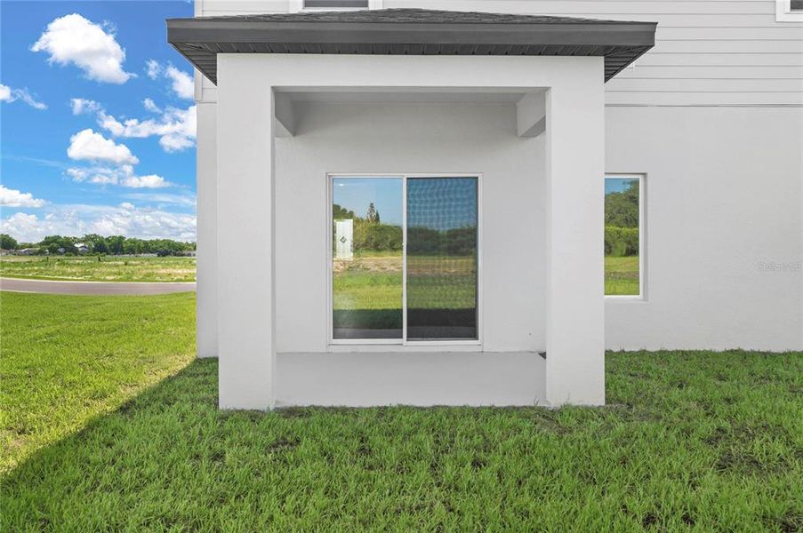 Exterior details and patio area of a home in Citrus Place, Babson Park (Image 3). Exterior details and patio area of a home in Citrus Place, Babson Park (Image 3).
