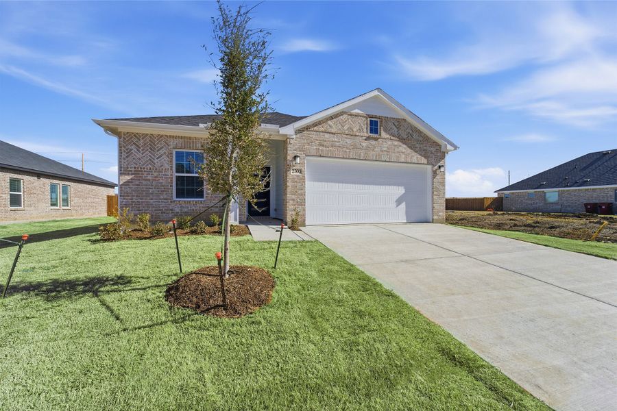 Front exterior of a new home in Pebblebrook, Sherman, TX, highlighting curb appeal (Image 25).