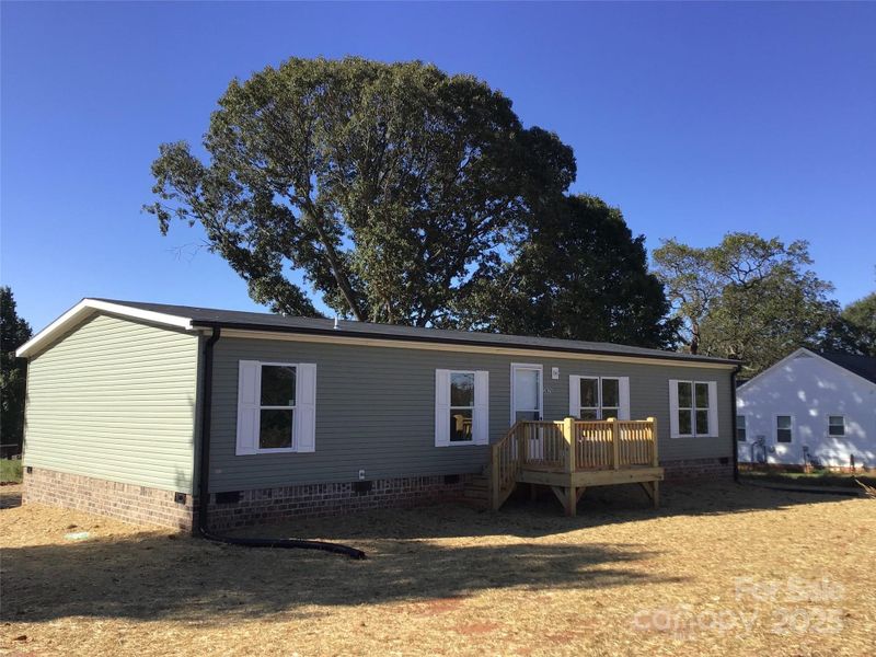 Front exterior of a new home in , Statesville, NC, highlighting curb appeal (Image 14).
