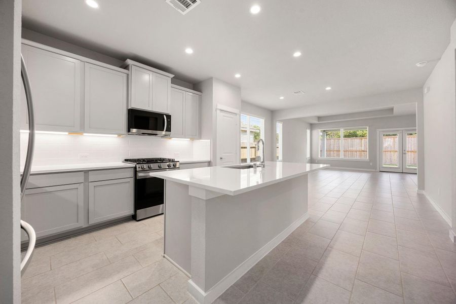 Kitchen includes under cabinet lighting