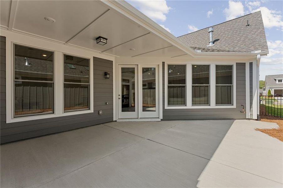 Exterior details and patio area of a home in The Courtyards at Bailey Farms, Dacula (Image 3).
