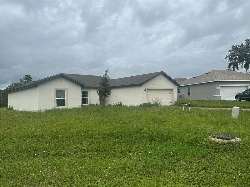 Front exterior of a new home in , Kissimmee, FL, highlighting curb appeal (Image 1). Front exterior of a new home in , Kissimmee, FL, highlighting curb appeal (Image 1).