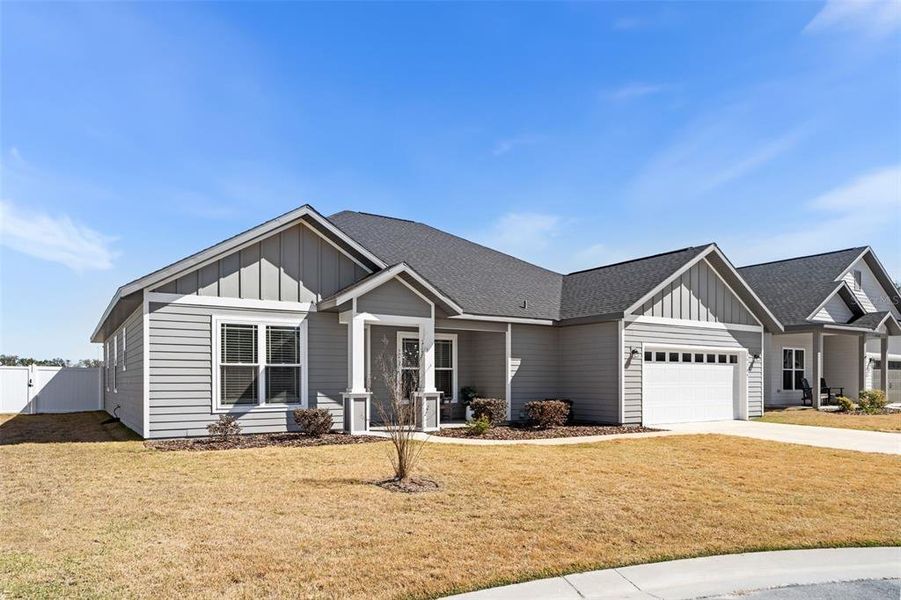 Front exterior of a new home in , Newberry, FL, highlighting curb appeal (Image 22).