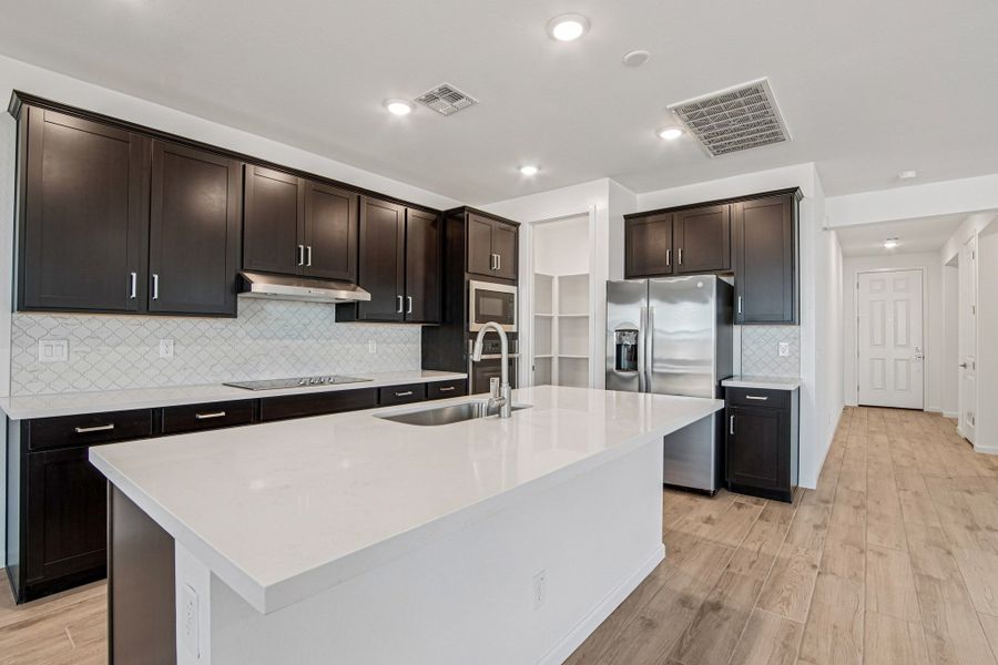 Gourmet Kitchen featuring the Roosevelt Collection. Finishes and options may vary by community