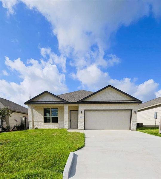 Brick & Stone front exterior, extra long driveway on an oversized lot!