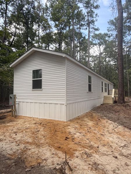 Exterior details and patio area of a home in , Round O (Image 11).