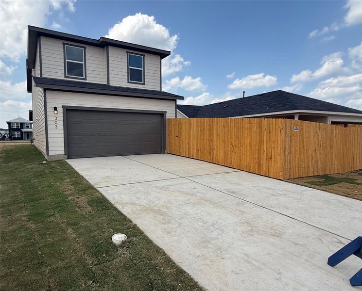 Front exterior of a new home in Valverde, Bastrop, TX, highlighting curb appeal (Image 1). Front exterior of a new home in Valverde, Bastrop, TX, highlighting curb appeal (Image 1).