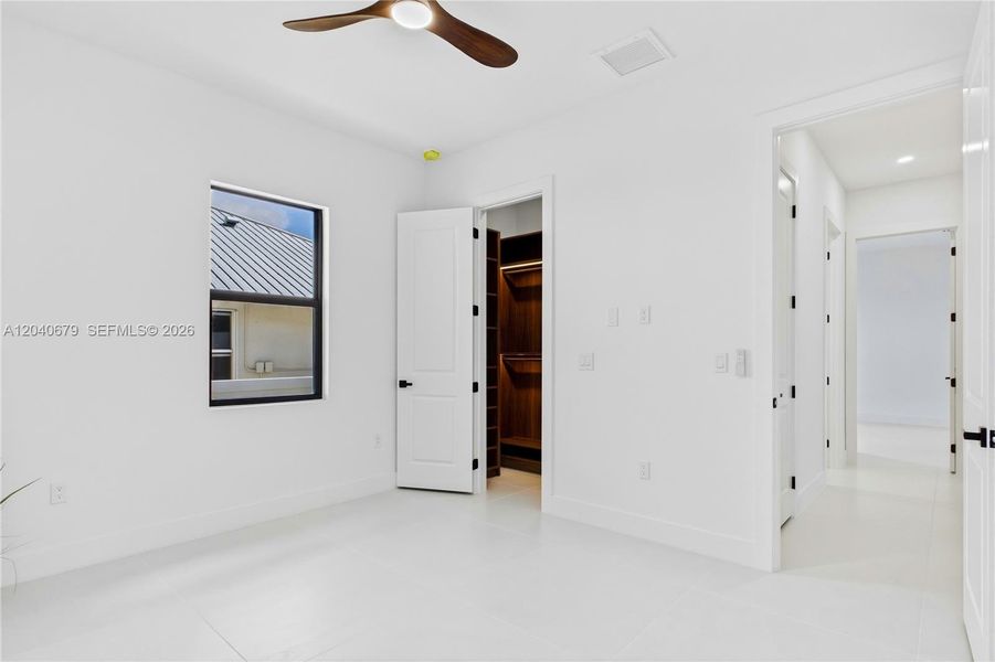 Bright and inviting guest bedroom offers comfort, privacy, and flexibility, making it ideal for family or visitors