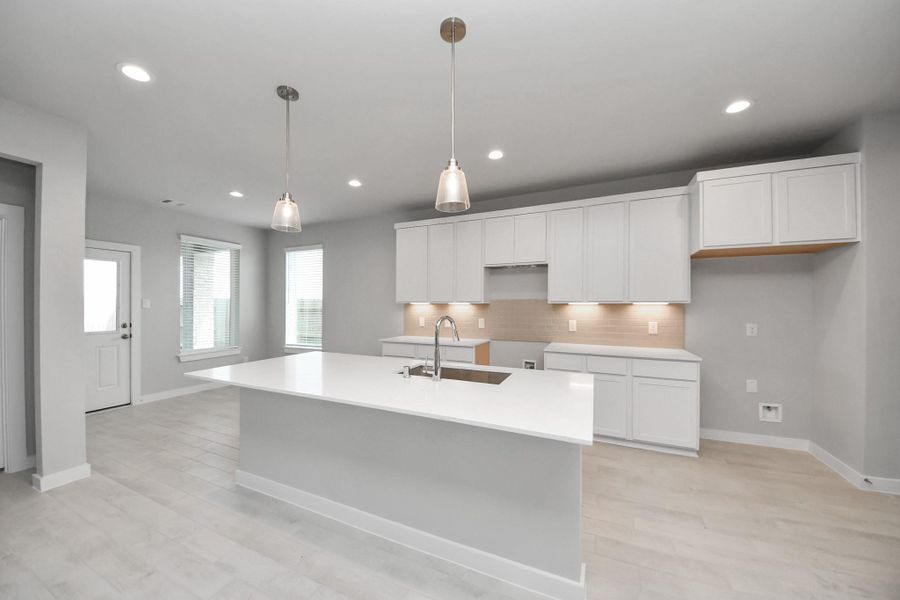 All of this overlooks your expansive family room, creating a perfect space for culinary delights and family gatherings.