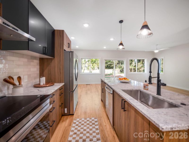 Custom lighting compliments this stunning space