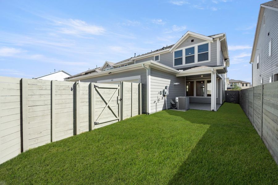 Exterior details and patio area of a home in Terrace Collection at Harvest, Argyle (Image 4).