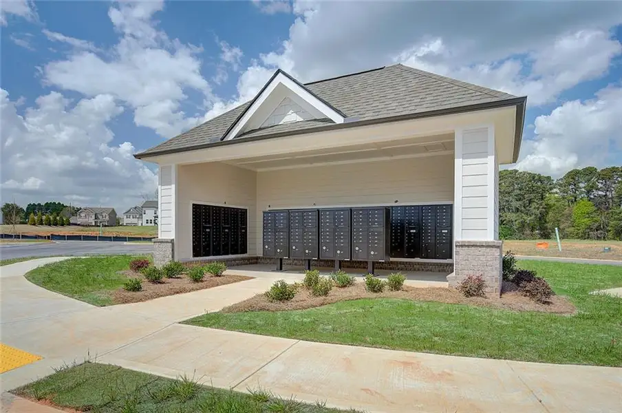 Front exterior of a new home in Summerlin, Winder, GA, highlighting curb appeal (Image 16).