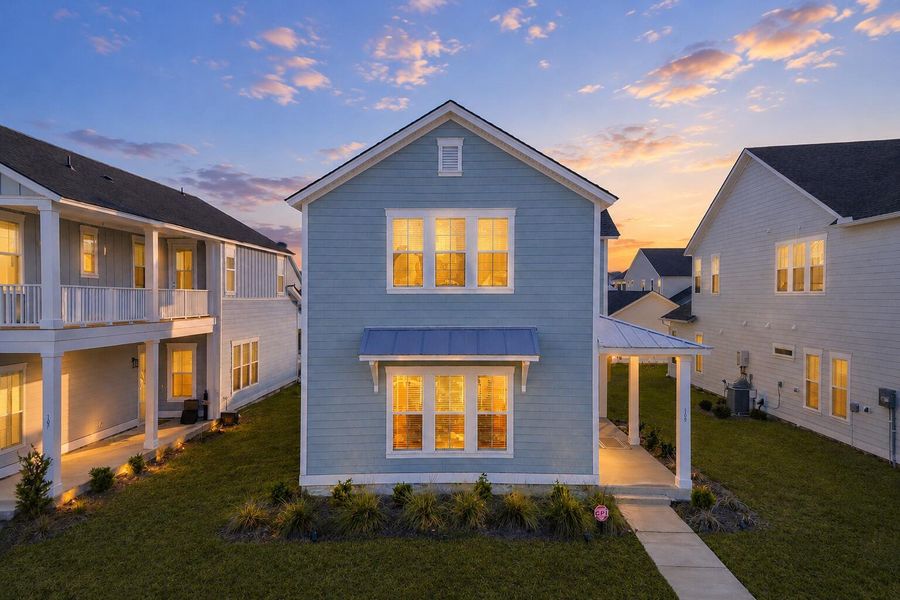 Front exterior of a new home in Carnes Crossroads, Summerville, SC, highlighting curb appeal (Image 2). Front exterior of a new home in Carnes Crossroads, Summerville, SC, highlighting curb appeal (Image 2).