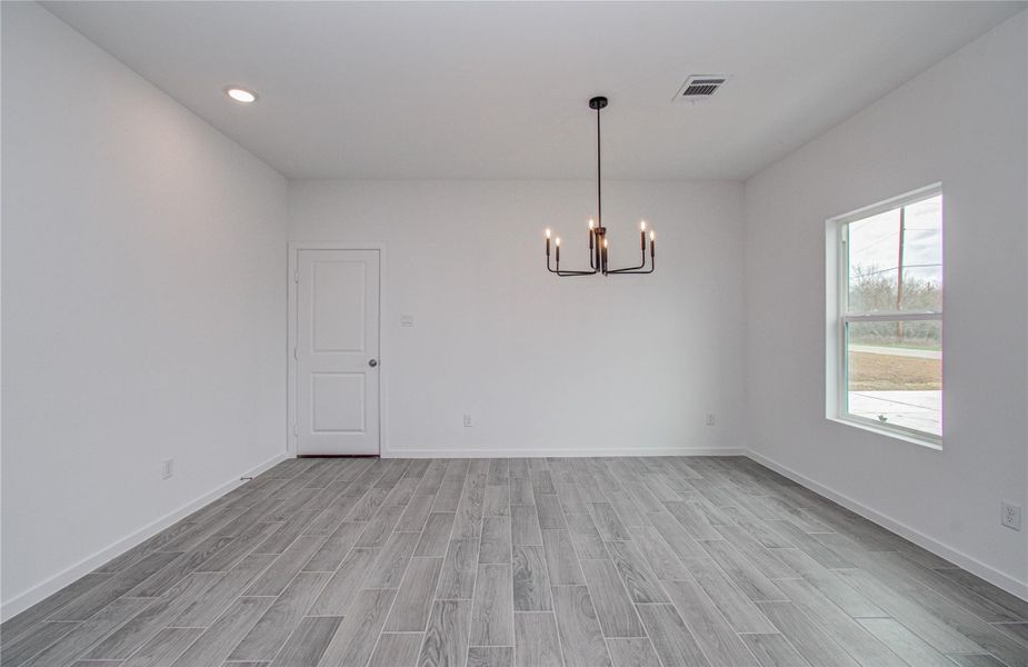 Dining AreaElegant dining space featuring modern lighting and a welcoming atmosphere.