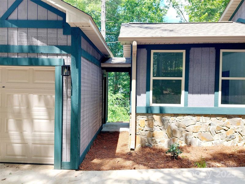 Front exterior of a new home in , Hendersonville, NC, highlighting curb appeal (Image 15).
