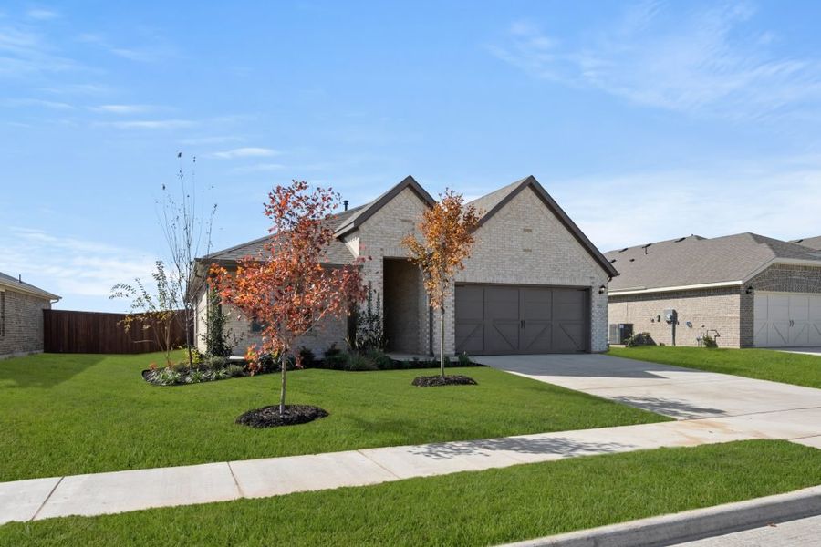 Representative exterior photo of a completed home built from the Lincoln by Impression Homes in Myrtle Creek, Waxahachie, TX (Image 9). Representative exterior photo of a completed home built from the Lincoln by Impression Homes in Myrtle Creek, Waxahachie, TX (Image 9).