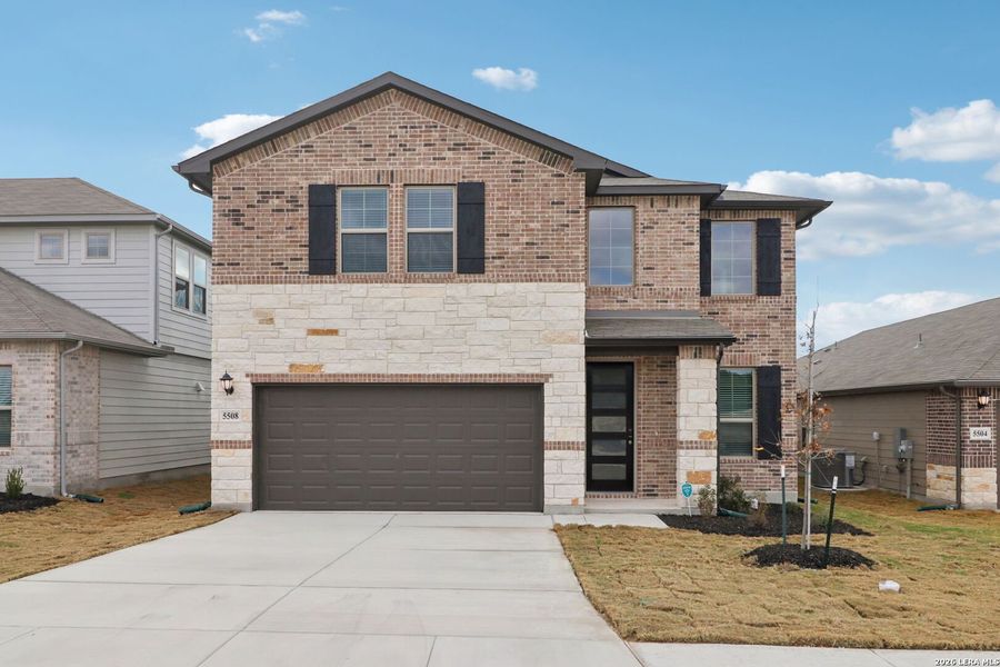 Front exterior of a new home in Legendary Trails - Premier Series, Cibolo, TX, highlighting curb appeal (Image 23).
