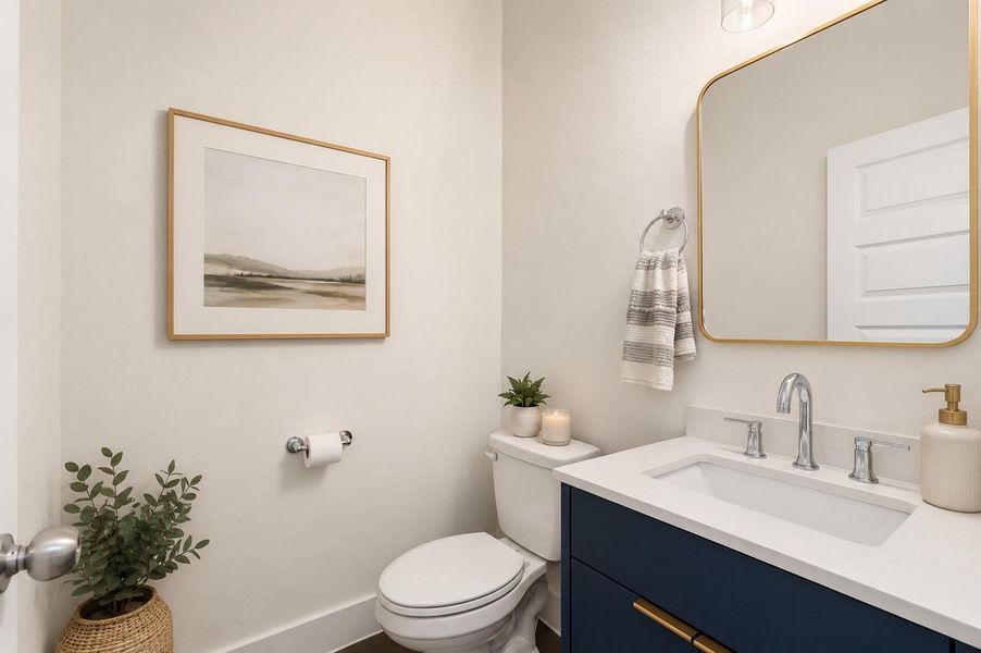 Modern half bath with quartz surfaces, designer fixtures, and clean contemporary finishes.