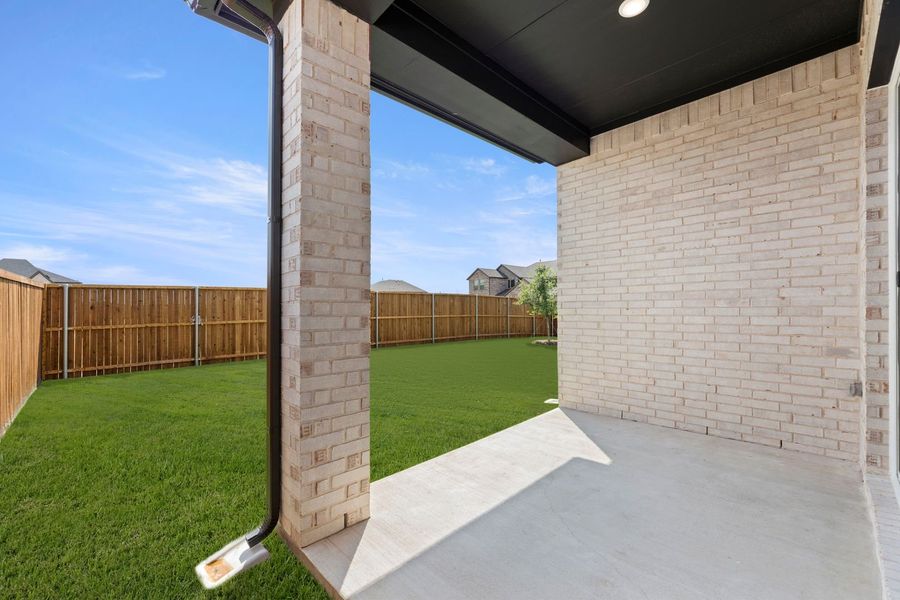 Exterior details and patio area of a home in Lily Creek at Sutton Fields, Aubrey (Image 2). Exterior details and patio area of a home in Lily Creek at Sutton Fields, Aubrey (Image 2).