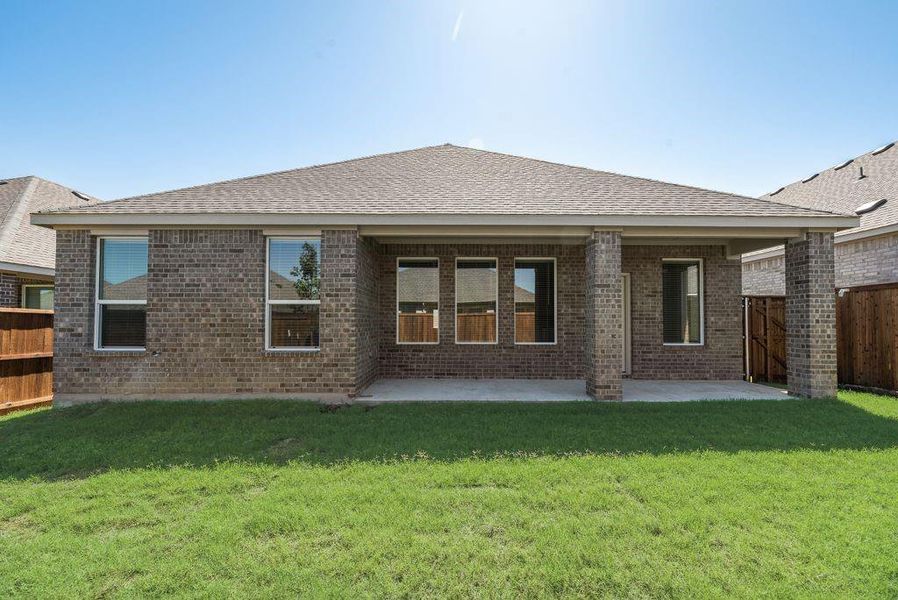 Front exterior of a new home in Legacy Hills: Classic Collection, Celina, TX, highlighting curb appeal (Image 14). Front exterior of a new home in Legacy Hills: Classic Collection, Celina, TX, highlighting curb appeal (Image 14).