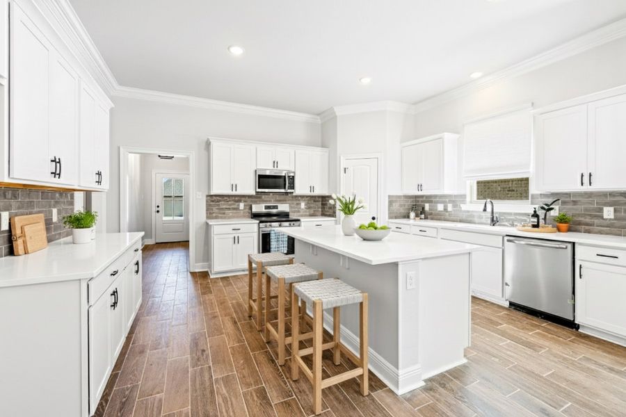 Front exterior of a new home in Sentinel Ridge, Pace, FL, highlighting curb appeal (Image 2).