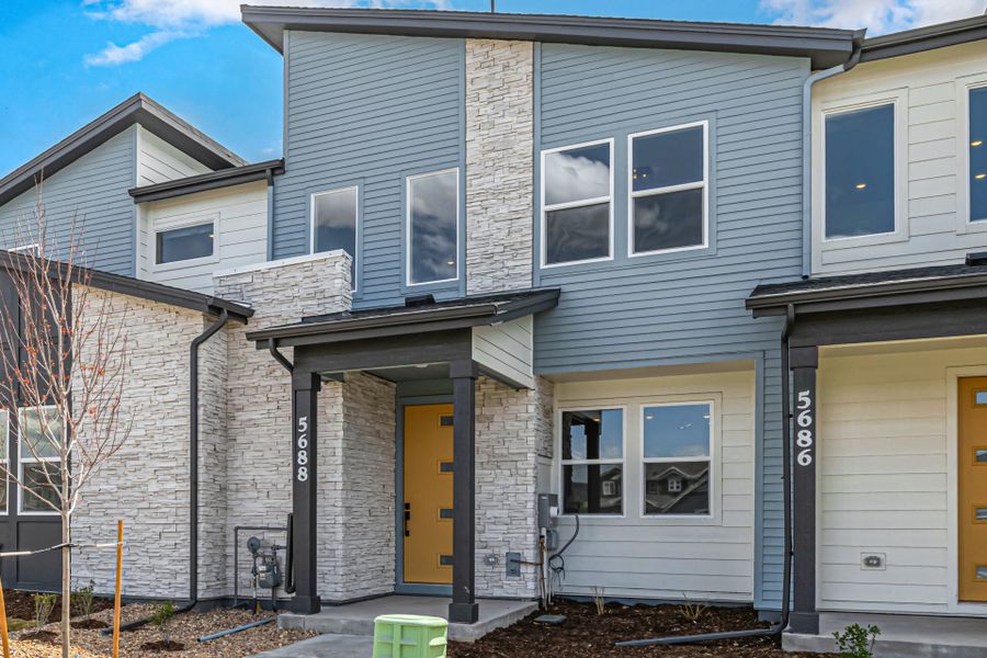 Front exterior of a new home in Painted Prairie, Aurora, CO, highlighting curb appeal (Image 25).