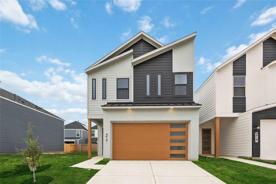 Front exterior of a new home in Alicante, Houston, TX, highlighting curb appeal (Image 2).