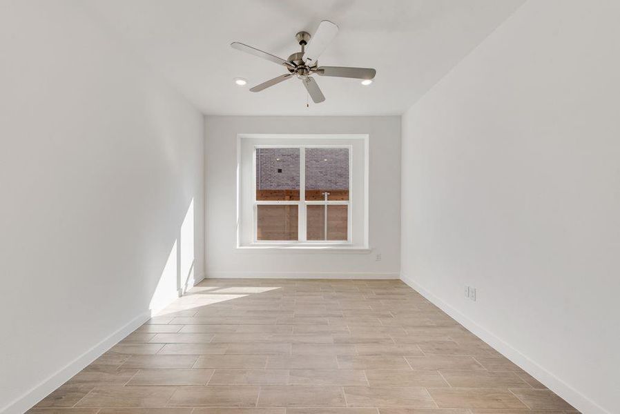 Unfurnished room with ceiling fan, light wood-type flooring, and recessed lighting