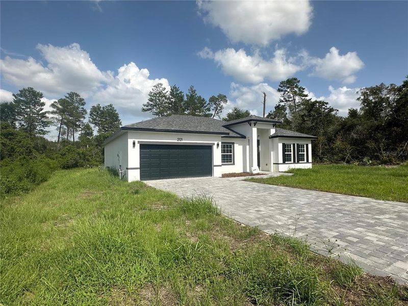 Front exterior of a new home in , Ocala, FL, highlighting curb appeal (Image 19).