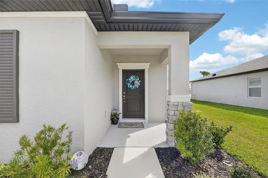 Exterior details and patio area of a home in Summerwoods, Parrish (Image 3).
