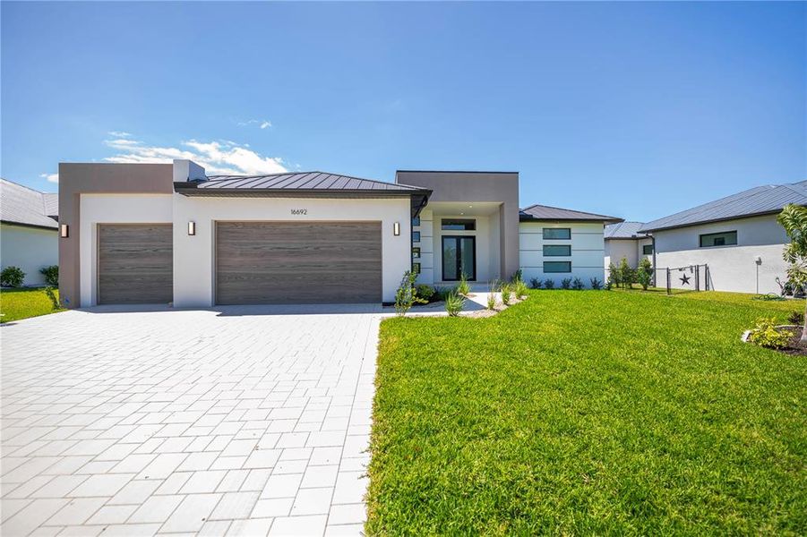 Front exterior of a new home in , Port Charlotte, FL, highlighting curb appeal (Image 1). Front exterior of a new home in , Port Charlotte, FL, highlighting curb appeal (Image 1).