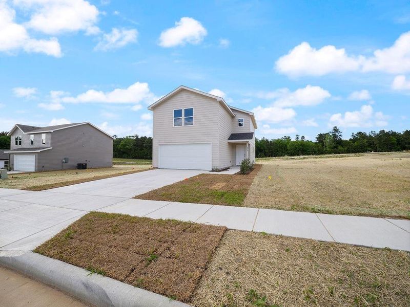 Front exterior of a new home in Stoney Ridge, Hudson, TX, highlighting curb appeal (Image 16).
