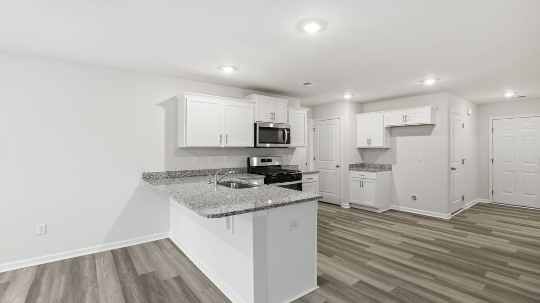 Furnished interior view inside a new home in Bentley Park, Greenwood (Image 8).