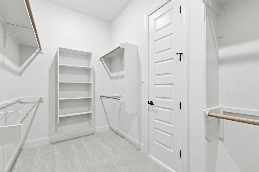 Walk in closet with light carpet Walk in closet with light carpet