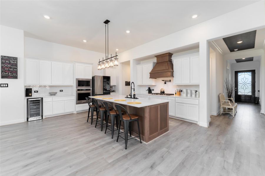 Upgraded vent hood and two tone cabinetry. Upgraded vent hood and two tone cabinetry.