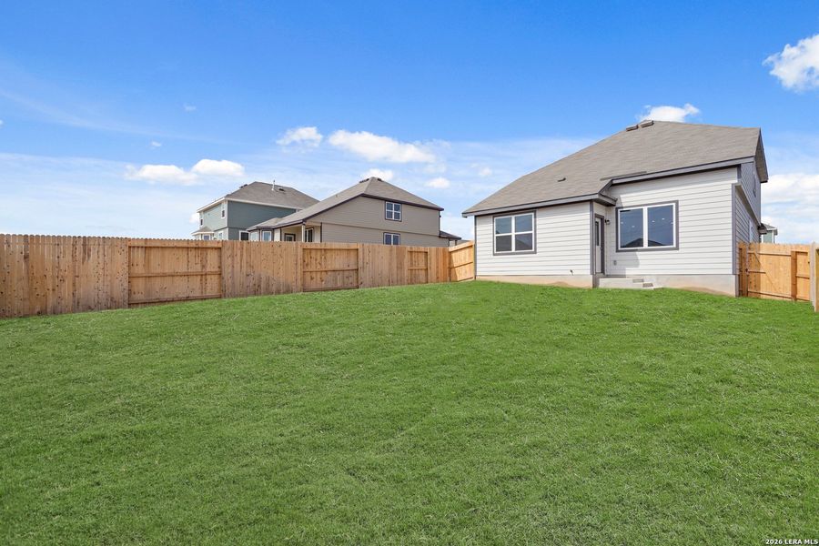Exterior details and patio area of a home in Hickory Ridge, Elmendorf (Image 3).