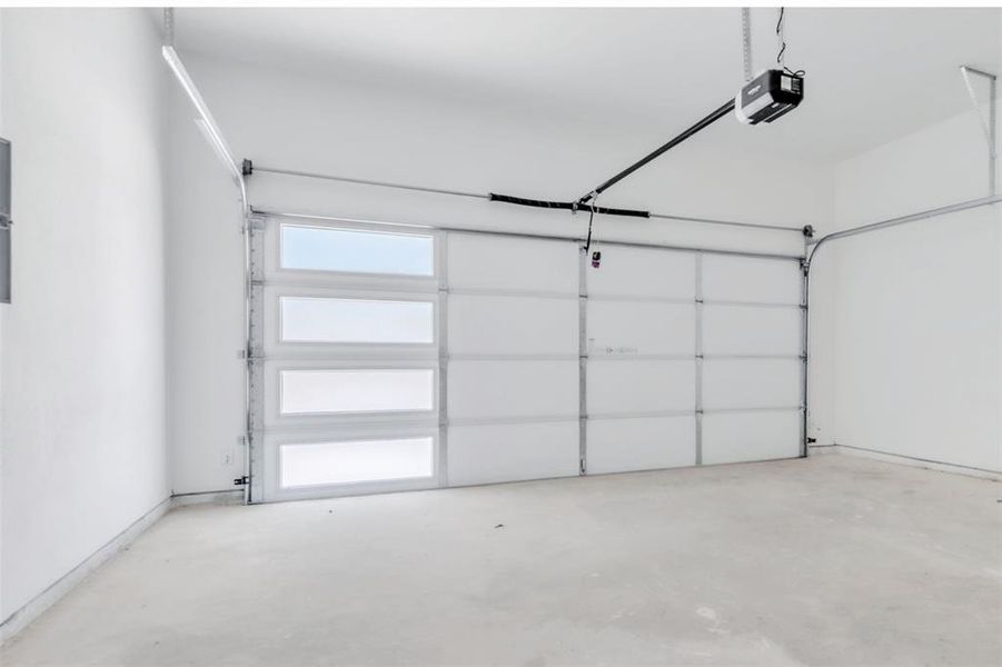 Modern, finished out garage with opener