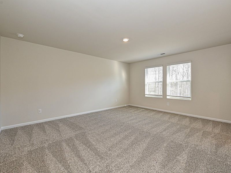 The primary bedroom lets in the perfect amount of natural light.