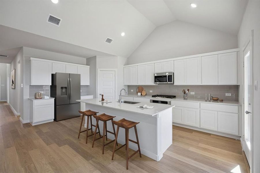 Kitchen in the Wimbledon home plan by Trophy Signature Homes – REPRESENTATIVE PHOTO Kitchen in the Wimbledon home plan by Trophy Signature Homes – REPRESENTATIVE PHOTO