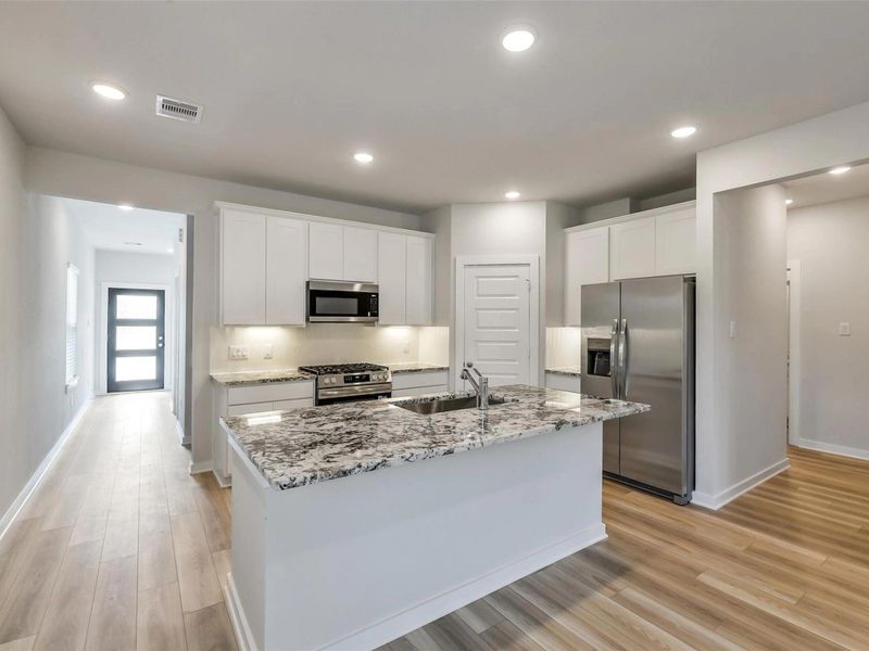 Furnished interior view inside a new home in Caney Creek Place, Conroe (Image 5).