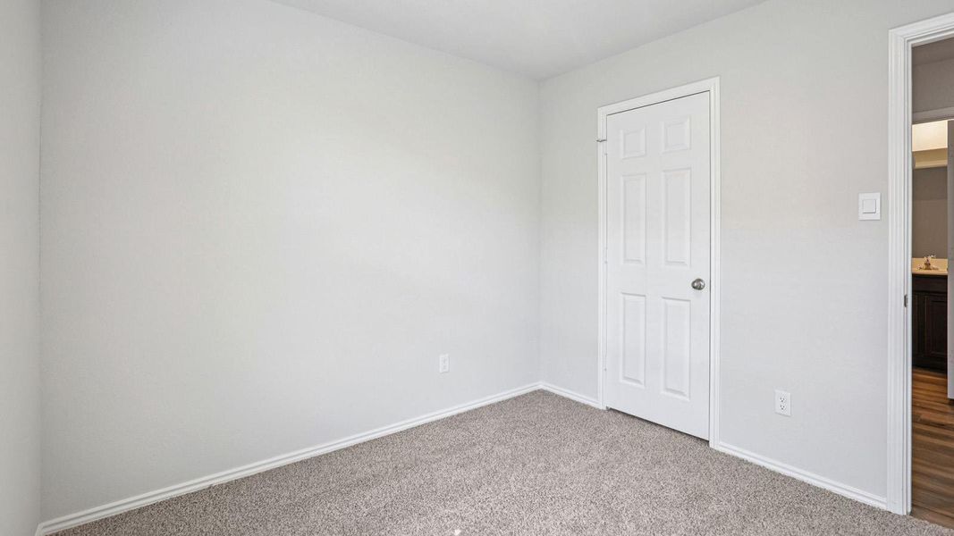 A well-maintained room with neutral tones, providing a versatile canvas for personalized decor. A well-maintained room with neutral tones, providing a versatile canvas for personalized decor.