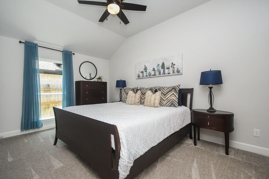 Fourth bedroom has ensuite and vaulted ceiling with walk-in closet