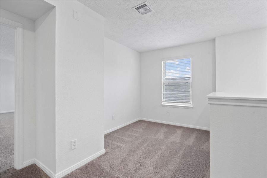 Additional seating nook just off the primary suite.