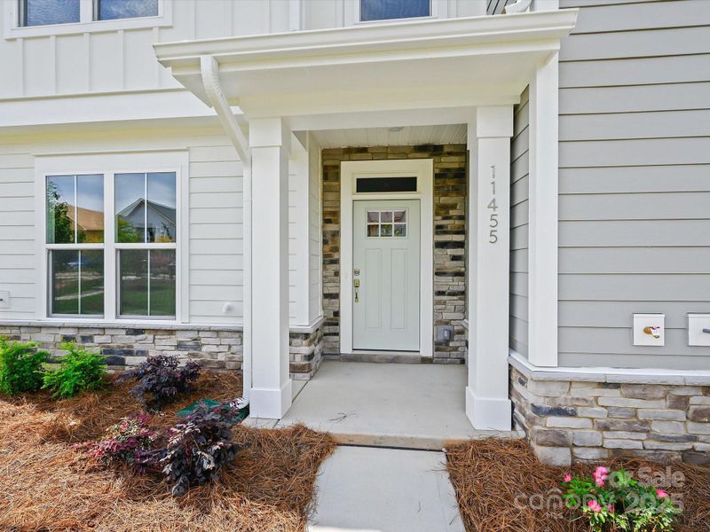 Front exterior of a new home in North Creek Village - Townhomes, Huntersville, NC, highlighting curb appeal (Image 20). Front exterior of a new home in North Creek Village - Townhomes, Huntersville, NC, highlighting curb appeal (Image 20).