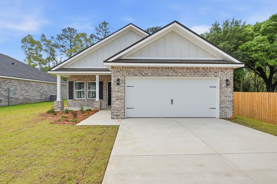 Front exterior of a new home in McCarthy Estates, Defuniak Springs, FL, highlighting curb appeal (Image 2). Front exterior of a new home in McCarthy Estates, Defuniak Springs, FL, highlighting curb appeal (Image 2).